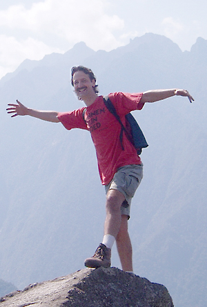 Bryan Nelson standing on top of a mountain in Peru.